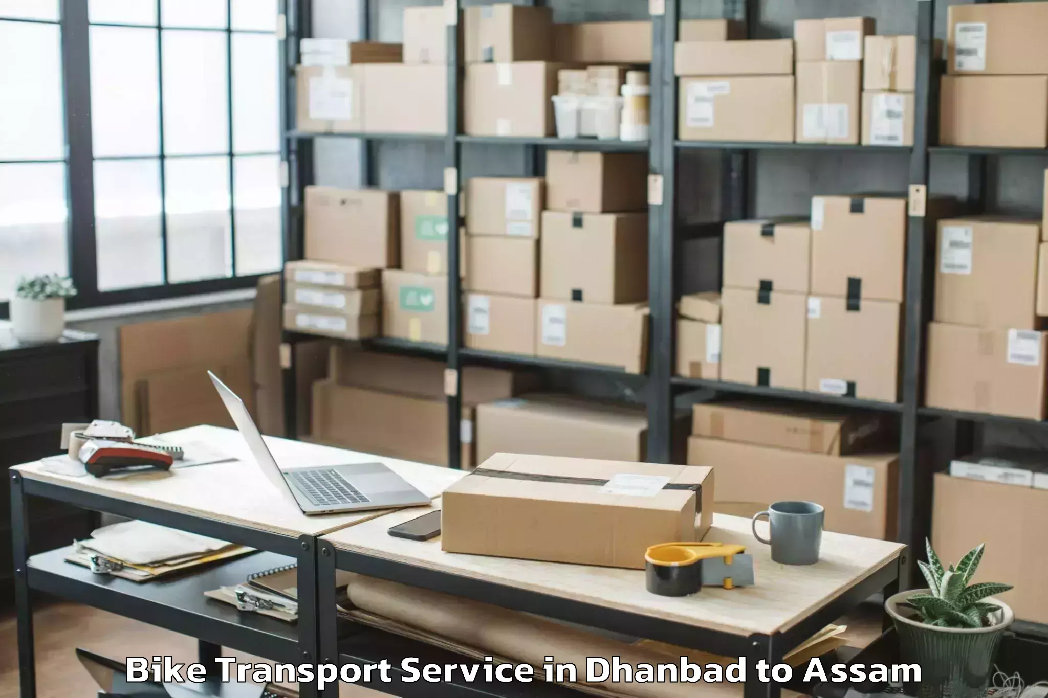 Book Dhanbad to Rupsi Airport Rup Bike Transport